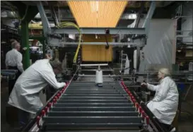  ?? MATT ROURKE — THE ASSOCIATED PRESS FILE ?? Workers manufactur­e thermal protection systems for NASA at Bally Ribbon Mills in Bally, Pa. U.S. employers pulled back on hiring in May 2017 by adding only 138,000 jobs. Hiring was still enough to help keep pushing unemployme­nt lower.