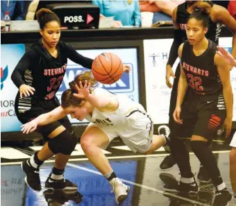  ?? STAFF PHOTOS BY ROBIN RUDD ?? The defense of Stewarts Creek’s Brandi Ferby (33) and Brianah Ferby (32) causes Bradley Central’s Emma Kate Brown to turn the ball over during their Class AAA sectional Saturday night in Cleveland. Stewarts Creek won 55-49 to advance to this week’s...
