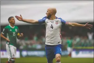  ?? The Associated Press ?? NATIONAL PRIDE: United States’ Michael Bradley celebrates after scoring against Mexico during a World Cup soccer qualifying match Sunday at the Azteca Stadium in Mexico City. The Americans hung on for a 1-1 tie to gain their third point at Azteca.