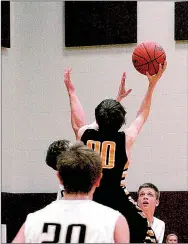  ?? MIKE CAPSHAW/ ENTERPRISE-LEADER ?? During a game against Inola (Okla.) on Dec. 31, Prairie Grove forward Cameron Simmons lofts a hook shot in the lane.