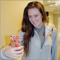  ?? TAMMY KEITH/RIVER VALLEY & OZARK EDITION ?? University of Central Arkansas junior Noelle Smith of Little Rock takes a selfie in Stanley Russ Hall on campus. Smith said she knew the UCA yearbook accepts selfies, but “I haven’t decided” whether to submit one, she said.