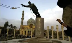  ?? Photograph: Jerome Delay/AP ?? A statue of Saddam Hussein being pulled down in Baghdad’s Firdos Square in April 2003.