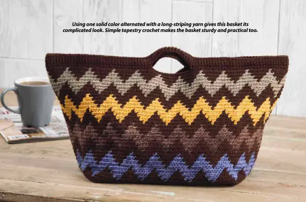  ??  ?? Using one solid color alternated with a long-striping yarn gives this basket its complicate­d look. Simple tapestry crochet makes the basket sturdy and practical too.