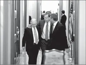  ?? AP/J. SCOTT APPLEWHITE ?? Arkansas’ U.S. Sen. John Boozman puts his arm around Sen. Jeff Sessions of Alabama after Senate Republican­s met Saturday before a vote on extending the debt ceiling.