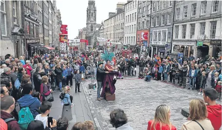  ?? Picture: PA. ?? Street performer Able Mable during her act on the Royal Mile in Edinburgh, as the main festival season officially got under way.