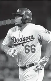  ?? Denis Poroy Getty Images ?? A STRAINED hamstring has kept Yasiel Puig on the shelf since April 24, and he’s not close to returning.