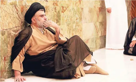  ?? FOTO: REUTERS ?? Nach seinem Wahlsieg besuchte Muktada al Sadr das Grab seines Vaters in Nadschaf.