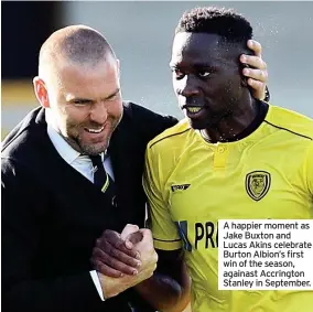  ??  ?? A happier moment as Jake Buxton and Lucas Akins celebrate Burton Albion’s first win of the season, againast Accrington Stanley in September.