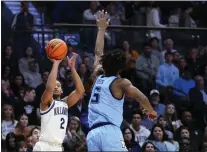  ?? MATT SLOCUM — THE ASSOCIATED PRESS ?? Villanova’s Mark Armstrong, left, goes up for a shot in Saturday’s game against Marquette’s Chase Ross. Armstrong scored a career-high 14points Wednesday in a win at Georgetown.