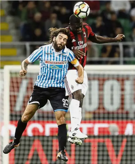  ??  ?? The saviour: Cristian Zapata (right) scored the equaliser against Inter Milan to keep AC Milan’s Europa League hopes alive. — AP