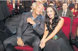  ?? CHRISTOPHE­R POLK/GETTY FILE ?? Actor Dwayne Johnson and Simone Alexandra Johnson attend the People’s Choice Awards in 2017 at the Microsoft Theater in Los Angeles.