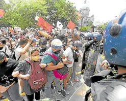  ?? —MARIANNE BERMUDEZ ?? OUTCOME DOUBTED Student activists gather outside the Comelec office in Intramuros, Manila, to protest the poll results on Tuesday.