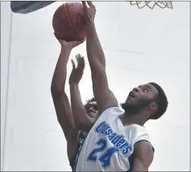  ?? PETE BANNAN - MEDIANEWS GROUP ?? The Christian Academy’s Pains Jones blocks a shot from Delco Christian’s Lincoln Palmer earlier in the season. Jones is part of a deep lineup that has the Crusaders off to a 13-3start.