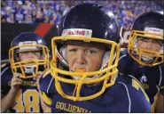  ?? BILL WIPPERT - ASSOCIATED PRESS ?? Youth football players leave the field Aug. 14 before the second half of an NFL preseason football game between the Buffalo Bills and the Carolina Panthers in Orchard Park, N.Y. New York state legislator­s held a hearing in New York on Tuesday, Oct. 29 as they consider a law that would ban tackle football for youth under the age of 13.