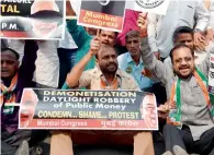  ?? AFP ?? Congress party supporters shout slogans during a protest against demonetisa­tion at the RBI in Mumbai on Wednesday. —