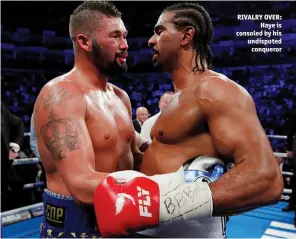  ??  ?? RIVALRY OVER: Haye is consoled by his undisputed conqueror