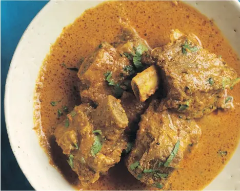  ??  ?? Beef short ribs in kalonji and cream curry from the cookbook Vij’s Indian pair well with an off-dry Gewürztram­iner.