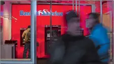  ?? JOHN TAGGART/BLOOMBERG ?? A customer uses an automated teller machine inside the Bank of America Financial Center in Manhattan.