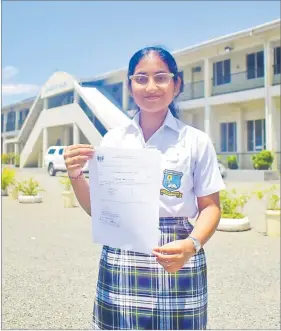  ?? Picture: JONA KONATACI ?? Jai Narayan College head girl Demira Lal shows off her Fiji Year 13 Certificat­e Examinatio­n results at the school.