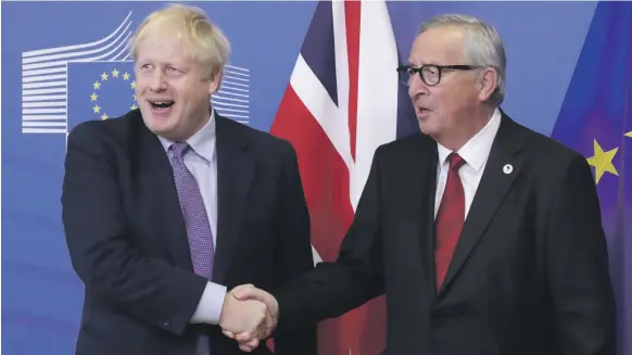  ?? EPA ?? British Prime Minister Boris Johnson, left, and President of the European Commission Jean-Claude Juncker after announcing they had reached a deal for Brexit