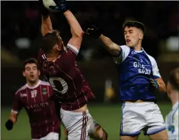  ?? ?? Tempo Captain Aidan Breen catches the ball under pressure from Devenish counterpar­t JJ O’brien.