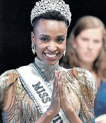  ?? Picture: PARAS GRIFFIN/GETTY IMAGES/AFP ?? ALL HAIL THE QUEEN: Miss Universe 2019 Zozibini Tunzi, of Tsolo, in the Eastern Cape, can't hold back her delight after winning the 2019 Miss Universe Pageant at Tyler Perry Studios in the US on Sunday.