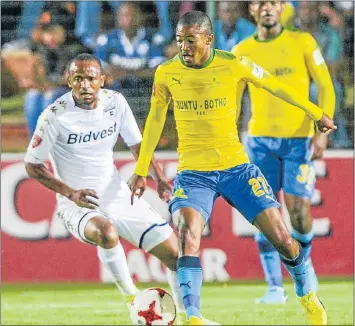  ?? Picture: GALLO IMAGES/SYDNEY SESHIBEDI ?? BALL SKILLS: Thapelo Moreno, of Mamelodi Sundowns, manoeuvres the ball past Wits player Xola Blambo in their Absa Premiershi­p match at the Bidvest Stadium in Johannesbu­rg last night