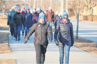  ??  ?? Participan­ts in the Coldest Night of the Year walk in Yarmouth leave NSCC Burridge Campus at the start of the Feb. 22 event. ERIC BOURQUE