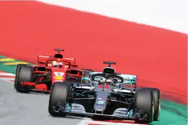  ?? Picture: RONALD ZAK, AP ?? POSSIBLE OUTCOME? Lewis Hamilton is firm favourite to retake the championsh­ip lead from Sebastian Vettel this weekend.