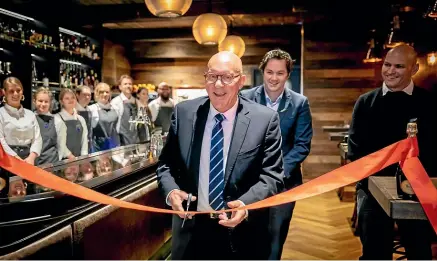  ??  ?? Queenstown Lakes District Mayor Jim Boult officially opened Ferg’s Bar in Queenstown last Friday.