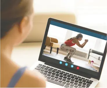  ?? GETTY IMAGES / ISTOCK PHOTO ?? Exercising with a buddy makes it easier to power through a difficult workout.