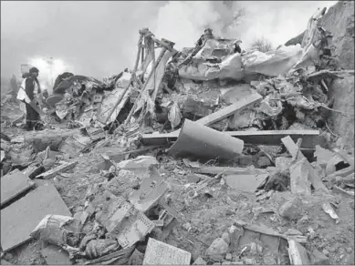  ??  ?? Rescue teams at the crash site of a Turkish cargo jet in Kyrgyzstan.(Photo: Xinhua)