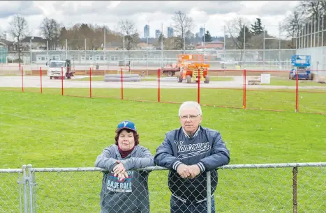  ?? ARLEN REDEKOP ?? Mary McCann and Tony Borean, the president and vice-president of Vancouver Minor Baseball, respective­ly, stand in front of the southeast diamond at Nanaimo Park at East 46th in Nanaimo on Tuesday. Field work on the diamond won’t be done in time for the...