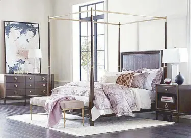  ??  ?? The Andover upholstere­d four-poster bed brings scale and grandeur.