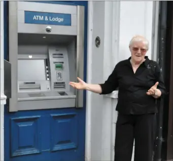  ??  ?? Maire Doddy outside the Ballymote branch of Bank of Ireland last week. Bank of Ireland say Ballymote branch is adopting the ‘Advice & Self Service’ model and coin transactio­n or foreign exchange services will no longer be available.