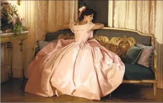  ?? Wilson Webb Sony Pictures ?? EMMA WATSON as Meg in “Little Women” is called out for the “fuss and feathers” of her gown.