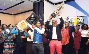  ?? HEMANS/PHOTOGRAPH­ER KENYON ?? The Southern Regional Office celebrates after being crowned the best office at the Transport Authority’s anniversar­y and awards luncheon held at The Jamaica Pegasus hotel in New Kingston, yesterday.