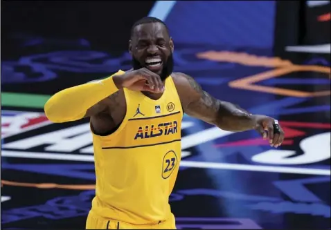  ?? Tribnue News Service ?? LeBron James smiles during the NBA All-Star game in Atlanta on Sunday. The NBA will open the second half of its season on Wednesday.