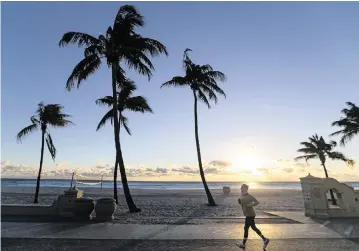  ?? MATIAS J. OCNER mocner@miamiheral­d.com ?? A runner makes her way down the Hollywood Beach Broadwalk on Jan. 14. Temperatur­es will plunge Thursday night and into Friday and Saturday, when it’s forecast to cool down to the 50s and 60s.