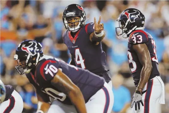  ?? AP PHOTO ?? SIGN OF THE FUTURE: Deshaun Watson, who a year ago led Clemson to the national championsh­ip, was drafted to be the eventual starting quarterbac­k for the Houston Texans. The Patriots are getting a look at Watson during combined workouts this week.