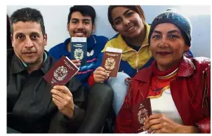 ??  ?? Going home: Venezuelan­s waiting to enter the boarding area of the airport in Lima after receiving a plane ticket paid by their government. — AFP