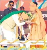  ?? PTI ?? Chhattisga­rh CM Raman Singh touches feet of his Uttar Pradesh counterpar­t Yogi Adityanath before filing his nomination papers from Rajnandgao­n seat on Tuesday.