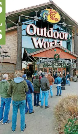  ?? [PHOTO BY PAUL HELLSTERN, THE OKLAHOMAN ARCHIVES] ?? The Bass Pro Shops in Bricktown opened in 2003. The store is considered a regional draw. Its holiday sales still attract lines of shoppers, as this 2016 photograph shows.