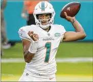  ?? CHARLES TRAINOR JR. / MIAMI HERALD ?? Miami Dolphins rookie quarterbac­k Tua Tagovailoa got a win in his firstNFL start Sunday against the Los Angeles Ramseven though he mustered only 93 yards passing.