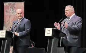  ?? GINO DONATO THE CANADIAN PRESS FILE PHOTO ?? Liberal Leader Steven Del Duca, left, watches as Progressiv­e Conservati­ve Leader Doug Ford speaks at the Federation of Northern Ontario Municipali­ties debate on May 10.