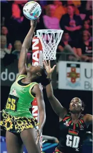  ?? FILE ?? Jamaica’s goalshoote­r Shanice Beckford in action against Malawi during the Fast5 Netball World Series last October. Beckford has been named in the team traveling to New Zealand for the Quad Series.