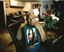  ?? MERIDITH KOHUT/THE NEW YORK TIMES ?? Victor Cabrales holds a portrait of his slain granddaugh­ter on Friday in Uvalde, Texas.“We need a change,” he says. “A real change. Not just words.”