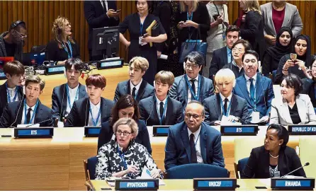  ??  ?? Making their voices heard: Members of K-pop group BTS (centre row) attending a meeting regarding youths during the 73rd session of the United Nations General Assembly in New York. — AP