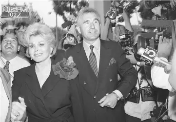  ??  ?? This file photo taken on Sept 11, 1989 shows US actress Zsa Zsa and by her husband Prince Frederick von Anhalt, Germany’s duke of Saxony, entering Beverly Hills Municipal Court on Sept 11, 1989. Zsa Zsa, the Hungarian-born Hollywood siren perhaps...