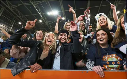  ?? — AFP ?? Fan-tastic: The crowd cheering during the Super Rugby match between the Otago Highlander­s and Waikato Chiefs at Forsyth Barr Stadium in dunedin yesterday.